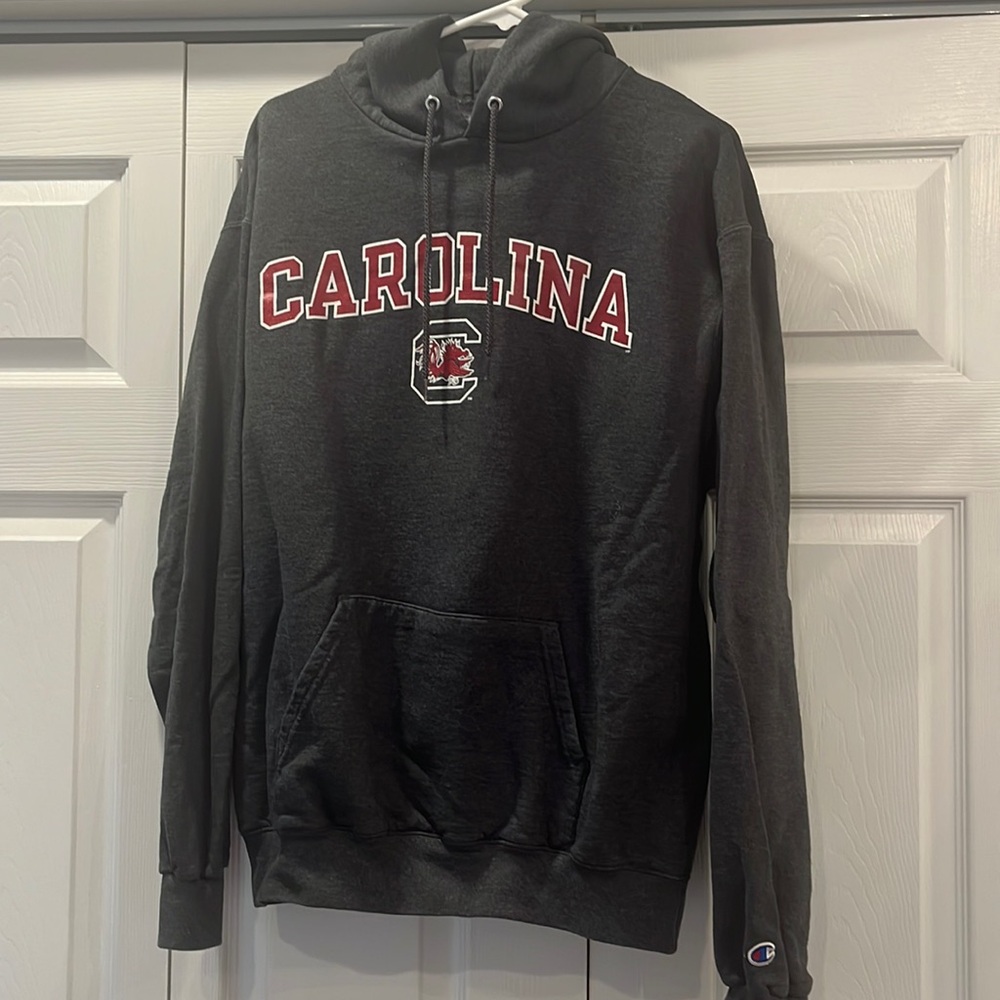 Can be unisex University of Carolina Gamecocks hooded sweatshirt. Dark grey.